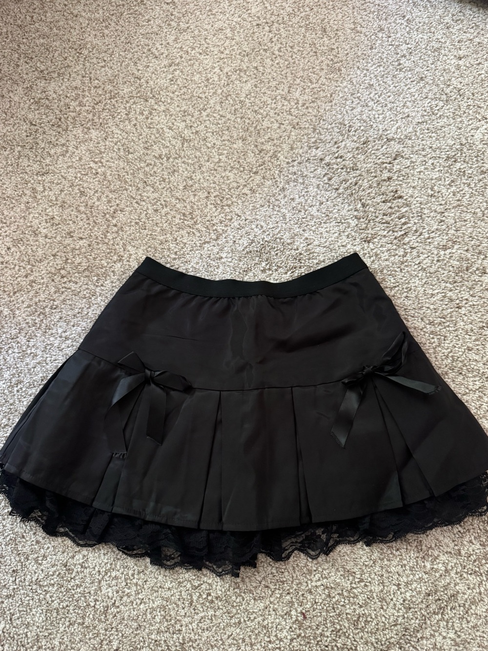 Black Pleated Lace-Hem Skirt with Bow Accents